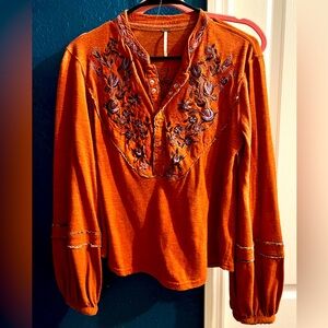 Free People orange blouse with puffed sleeves